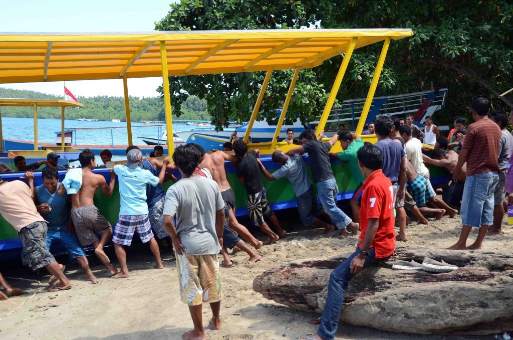 Last shove to get the boat into the water
