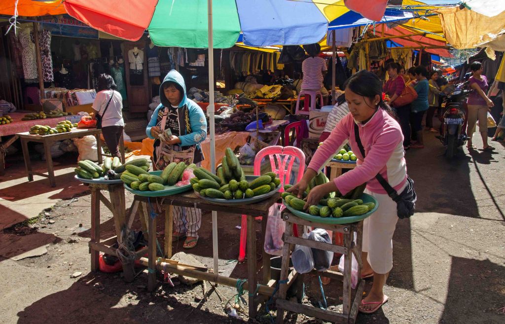 Ladies selling cucumbers, Tomohon market, Sulawesi.