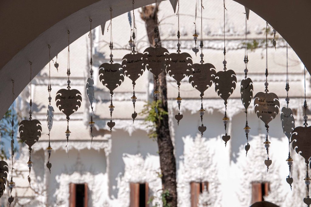 The ubosot at Wat Rong Khun from the wishing well