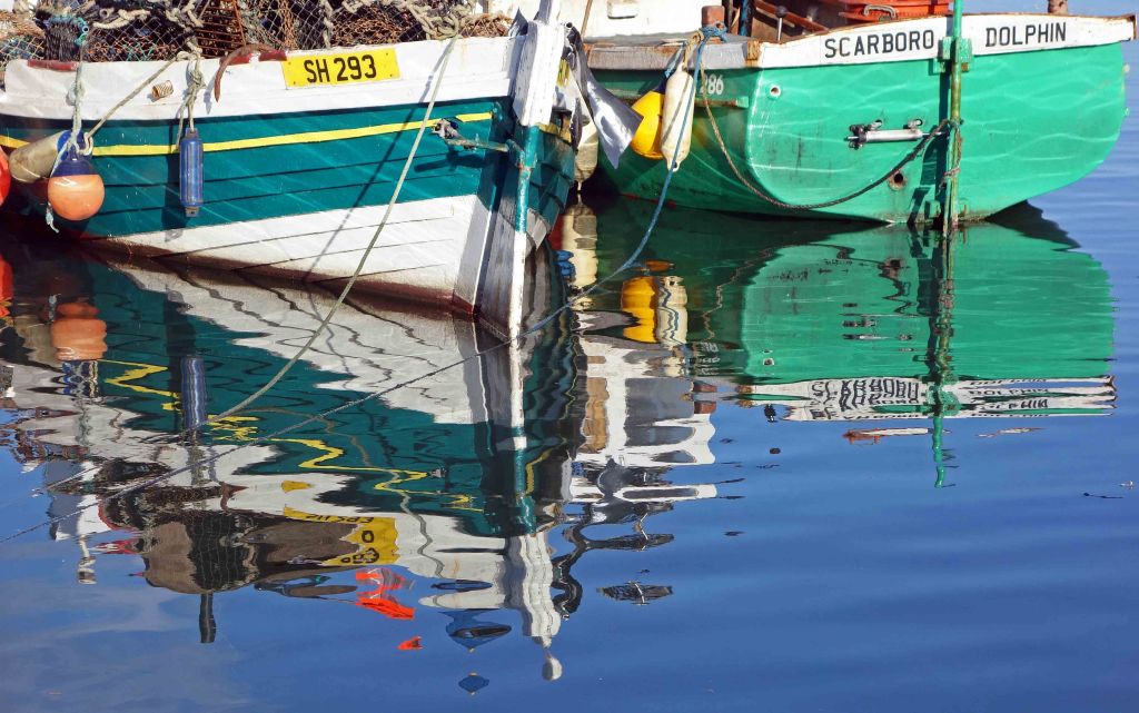 Boats reflected in the harbour