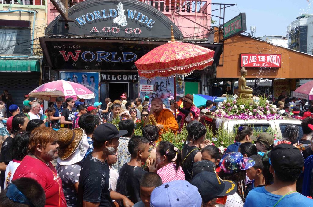 Monk delivering watery blessing along Beach Road, Pattaya.